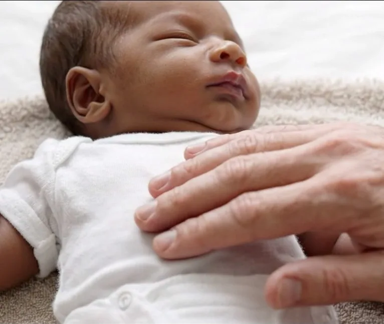 A baby appearing very drowsy and difficult to rouse during a fever